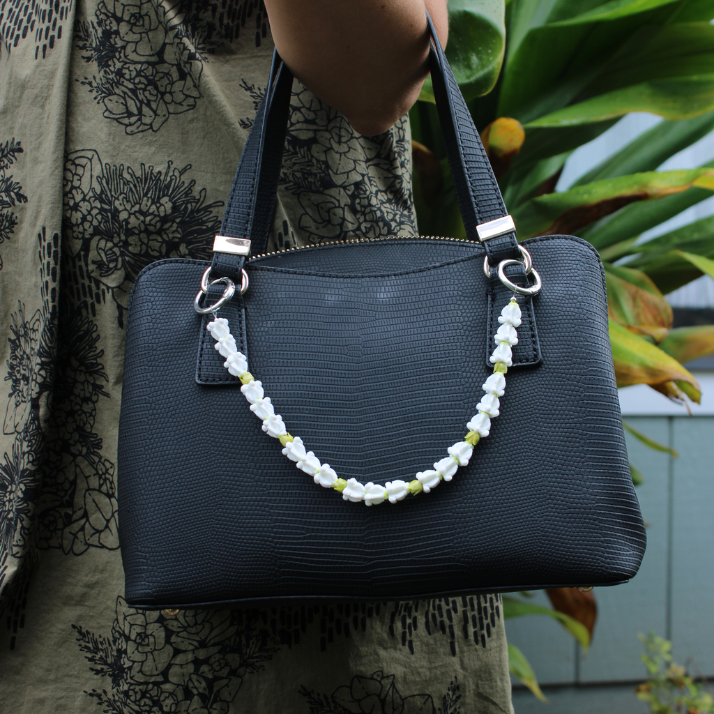 Brianne & Co. white crown flower and green Pamala short purse lei handmade in Kauai