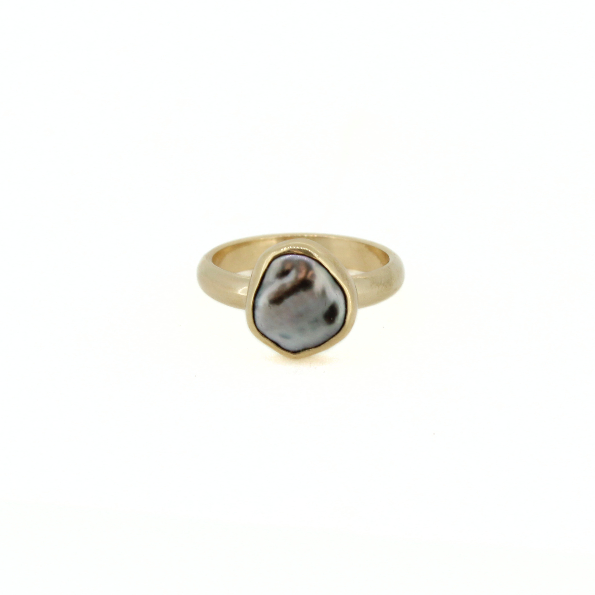 Gold-tone ring with dark baroque keshi pearl centerpiece in oval bezel