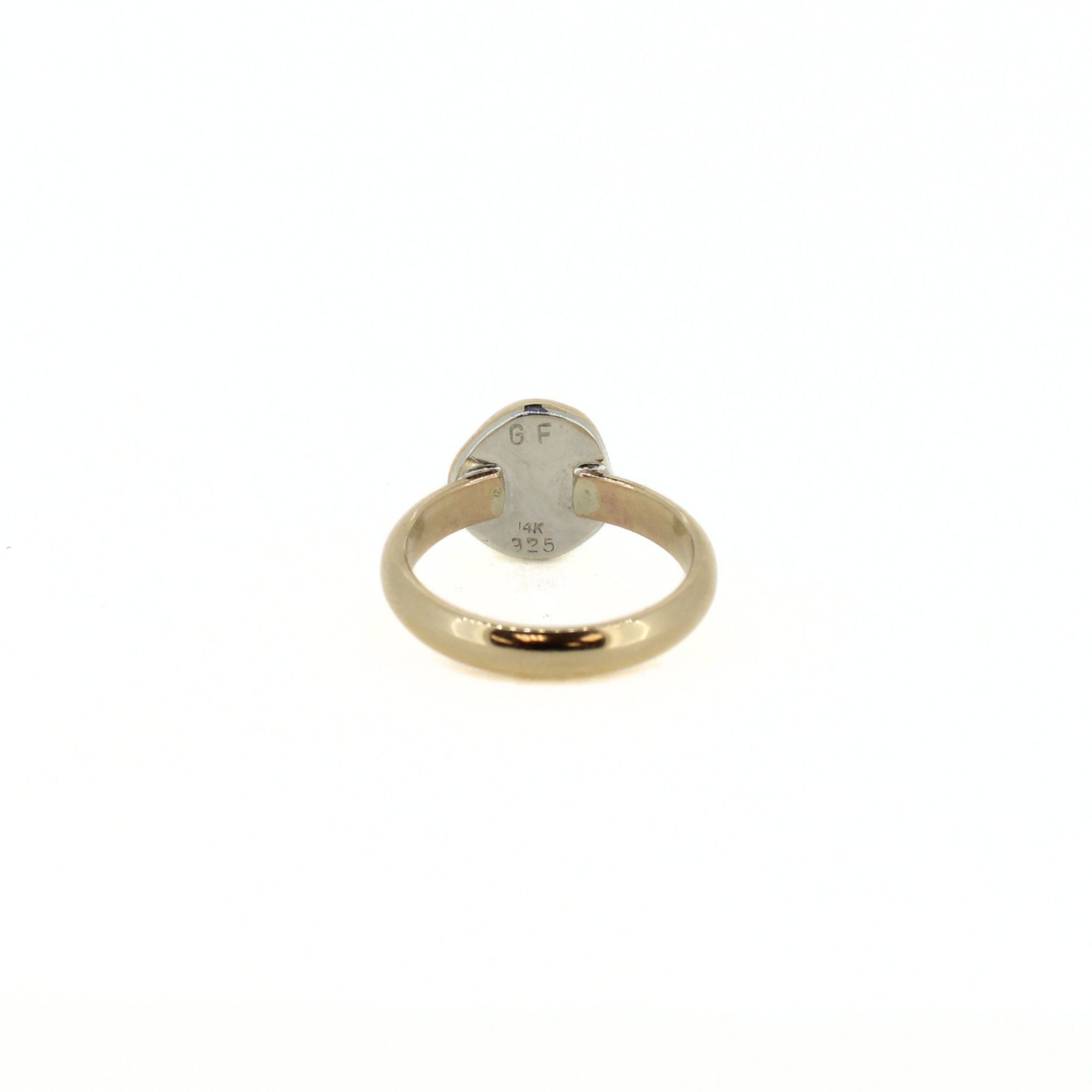 Gold-tone ring back with hallmark stamped on band