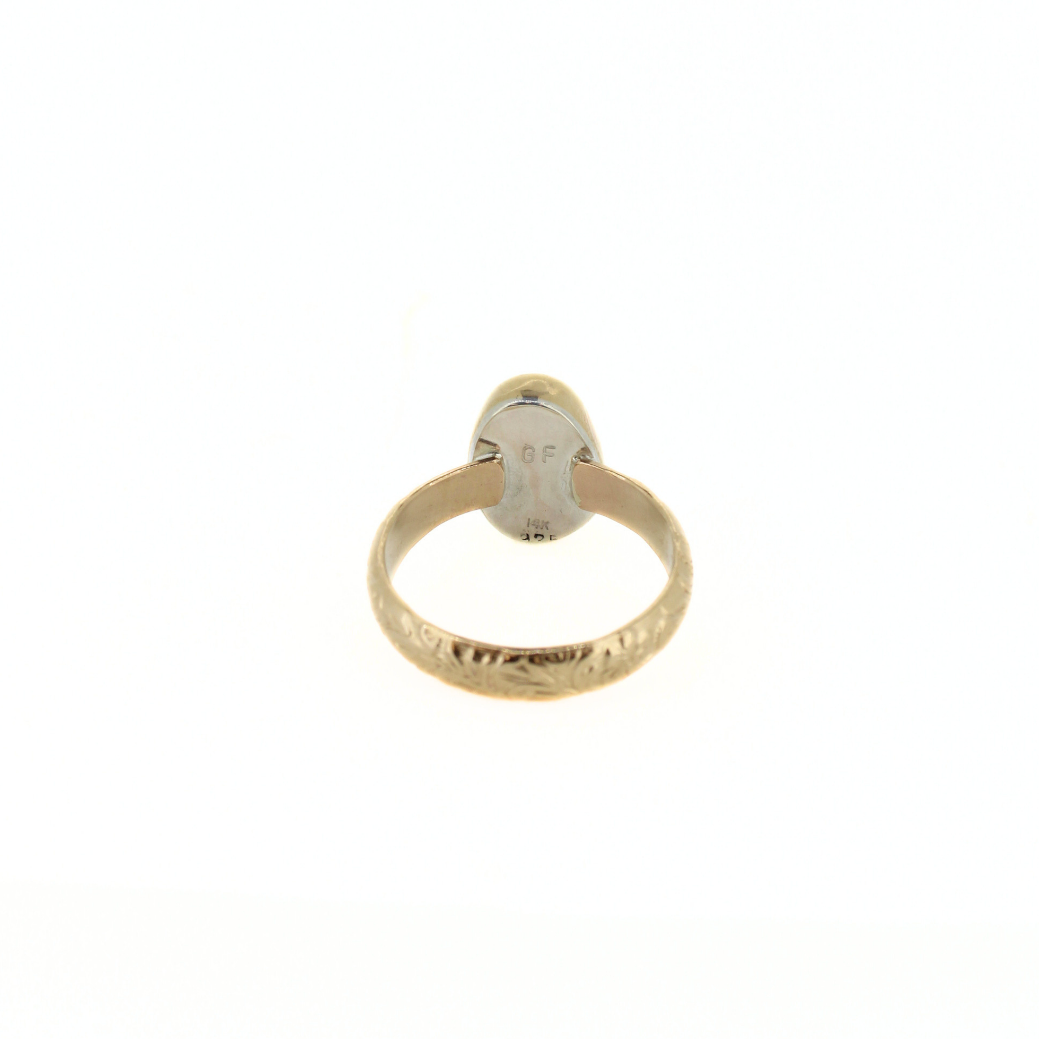 Back of gold ring, stamped marking on band
