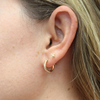 Brianne & Co. gold fill mini hoop earrings 13mm large on ear