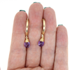 Brianne & Co. gold fill 18mm hoop earrings with amethyst gemstones front facing view