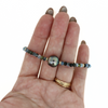 Brianne & Co. gold fill aquamarine and Tahitian pearl bracelet on hand for size reference