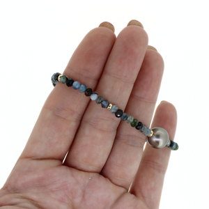 Brianne & Co. gold fill aquamarine and Tahitian pearl bracelet side close up view of gemstones