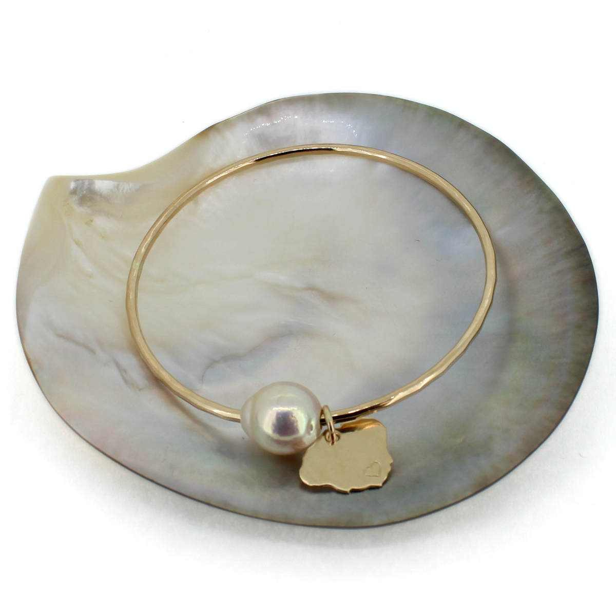 Brianne & Co. 14k gold fill bangle bracelet featuring a white baroque Edison pearl and Kauai island charm