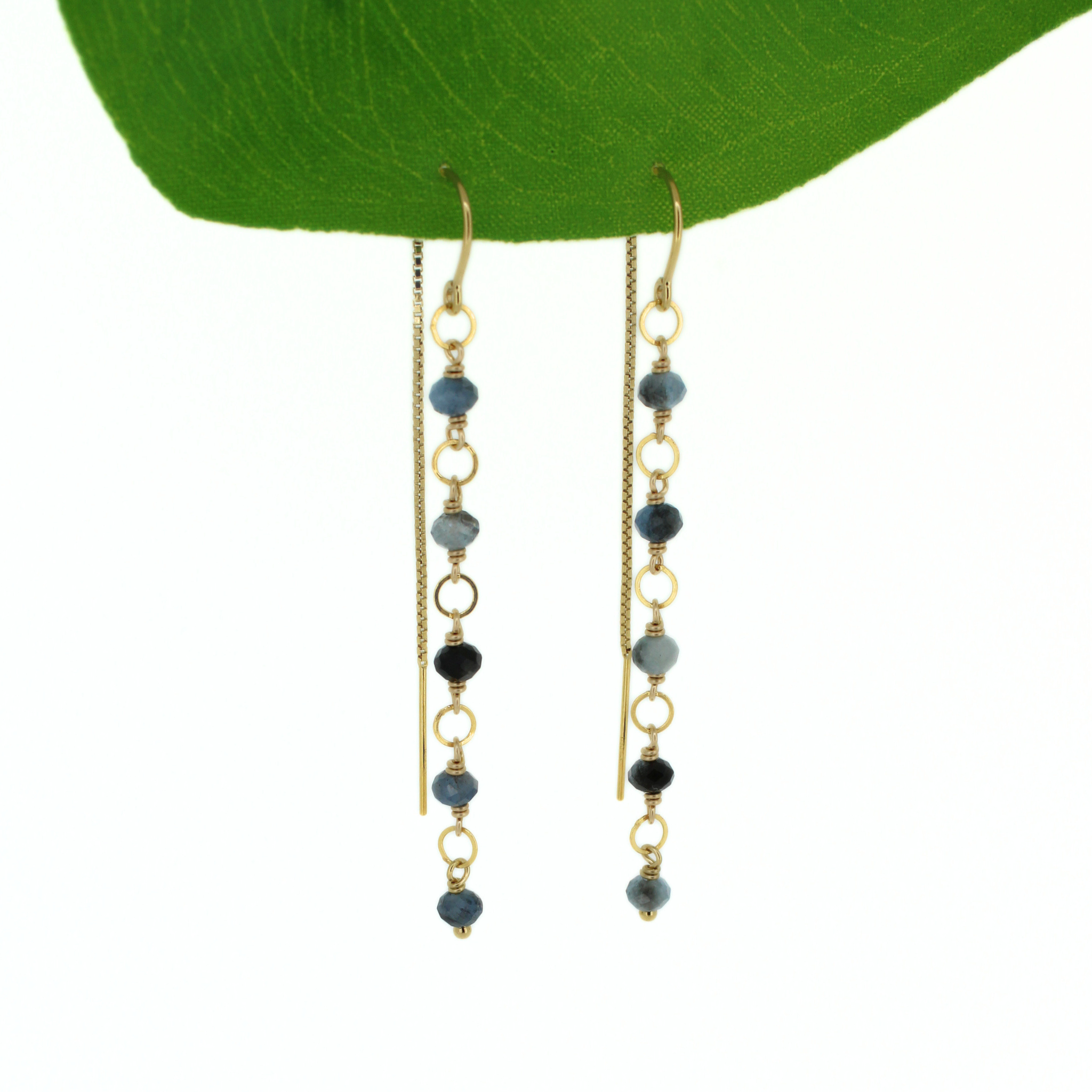Brianne & Co. 14k gold fill threader style earrings featuring faceted dark blue aquamarine gemstones