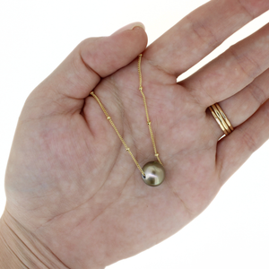 Brianne & Co. gold fill floating Tahitian pearl necklace on hand for size reference 