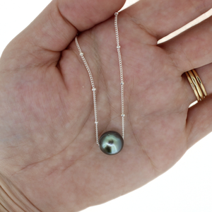 Brianne & Co. sterling silver floating Tahitian pearl necklace on hand for size reference