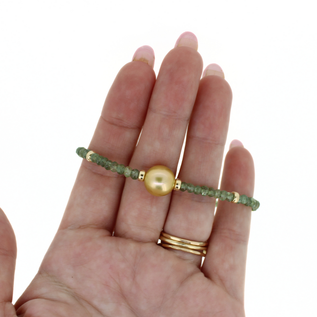 Brianne & Co. gold fill golden south sea pearl and green apatite gemstone bracelet  on hand