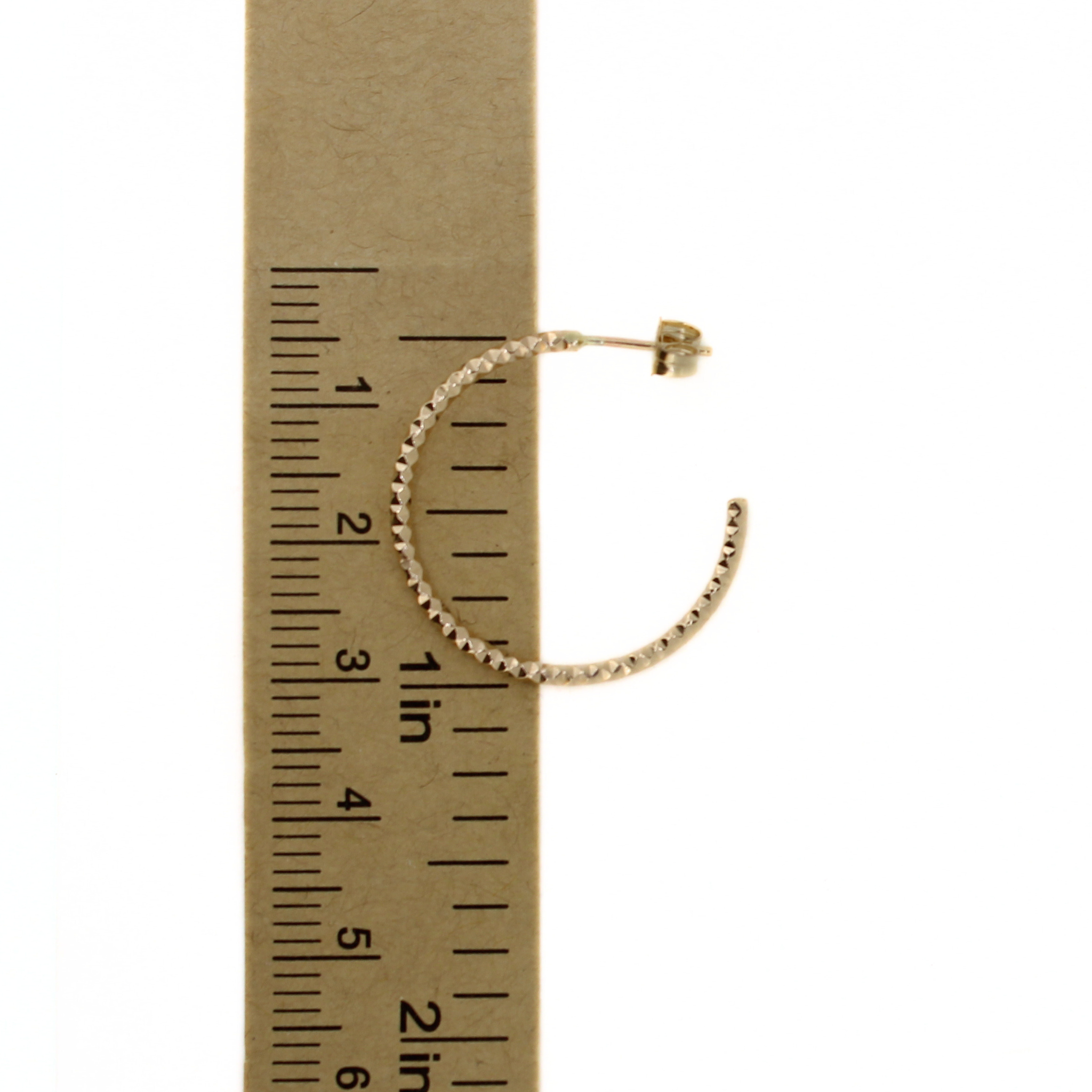 Brianne & Co. gold fill faceted hoop earrings measuring 1" in diameter