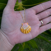 Brianne & Co. orange sunrise shell necklace on hand