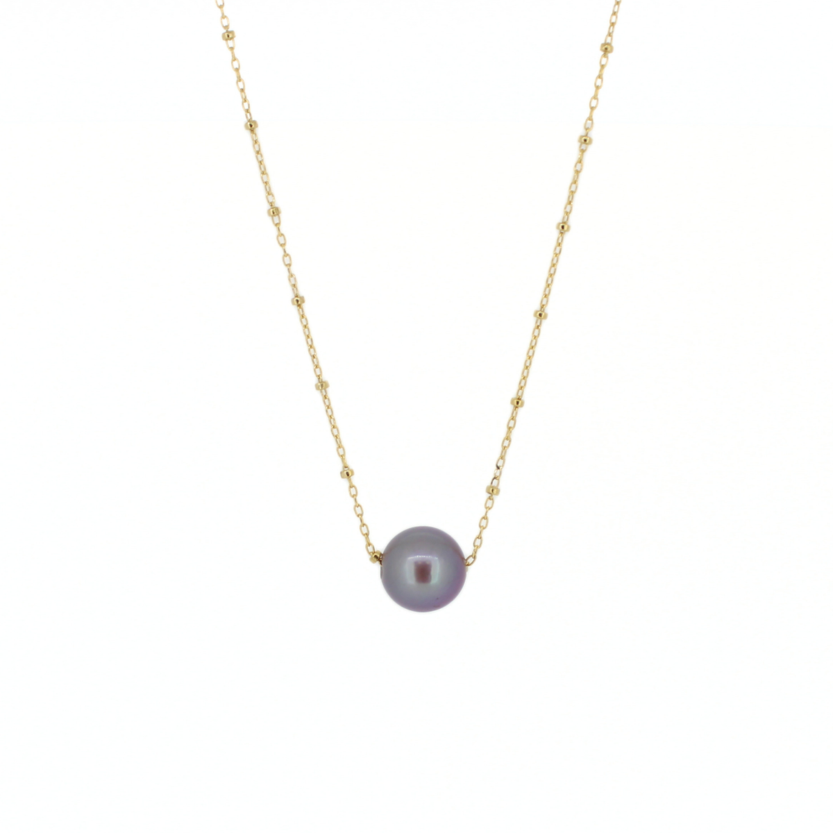 A delicate gold chain necklace featuring a single round, lustrous grayish-purple pearl pendant, set against a solid white background.