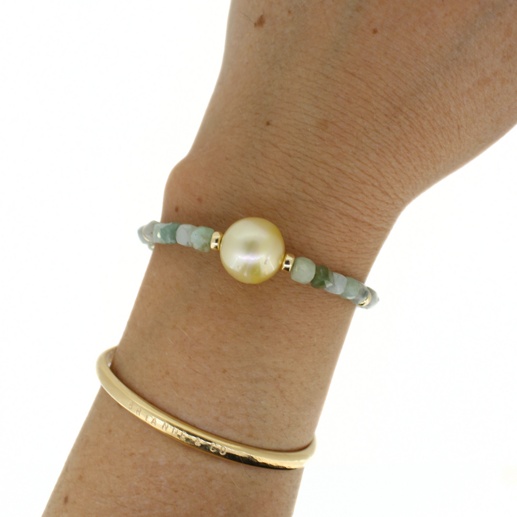 Brianne & Co. gold fill golden south sea pearl and jade bracelet on wrist for size reference