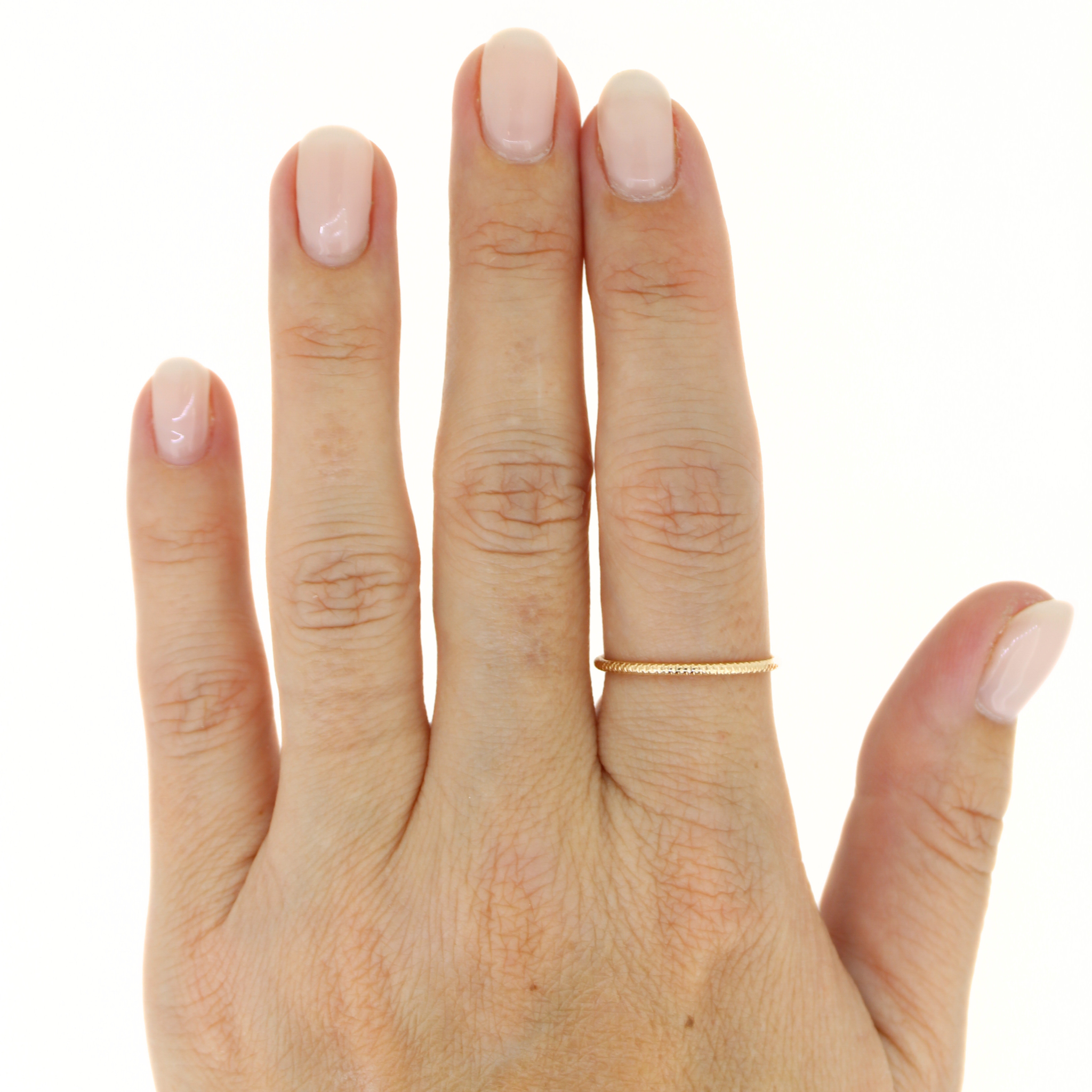 Brianne & Co. gold fill sparkle stacker ring on hand model