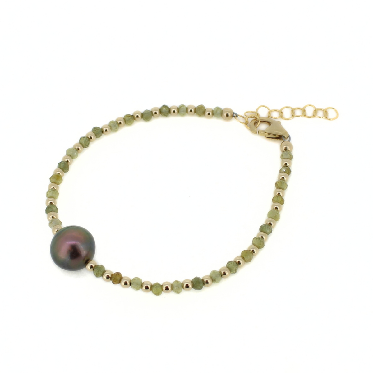 A delicate gold beaded bracelet featuring small faceted green beads and a single large, iridescent dark green pearl, displayed on a clean white background.