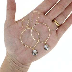 Brianne & Co. gold fill tear drop hoop earrings w/ large Tahitian keshi pearls on hand for size reference