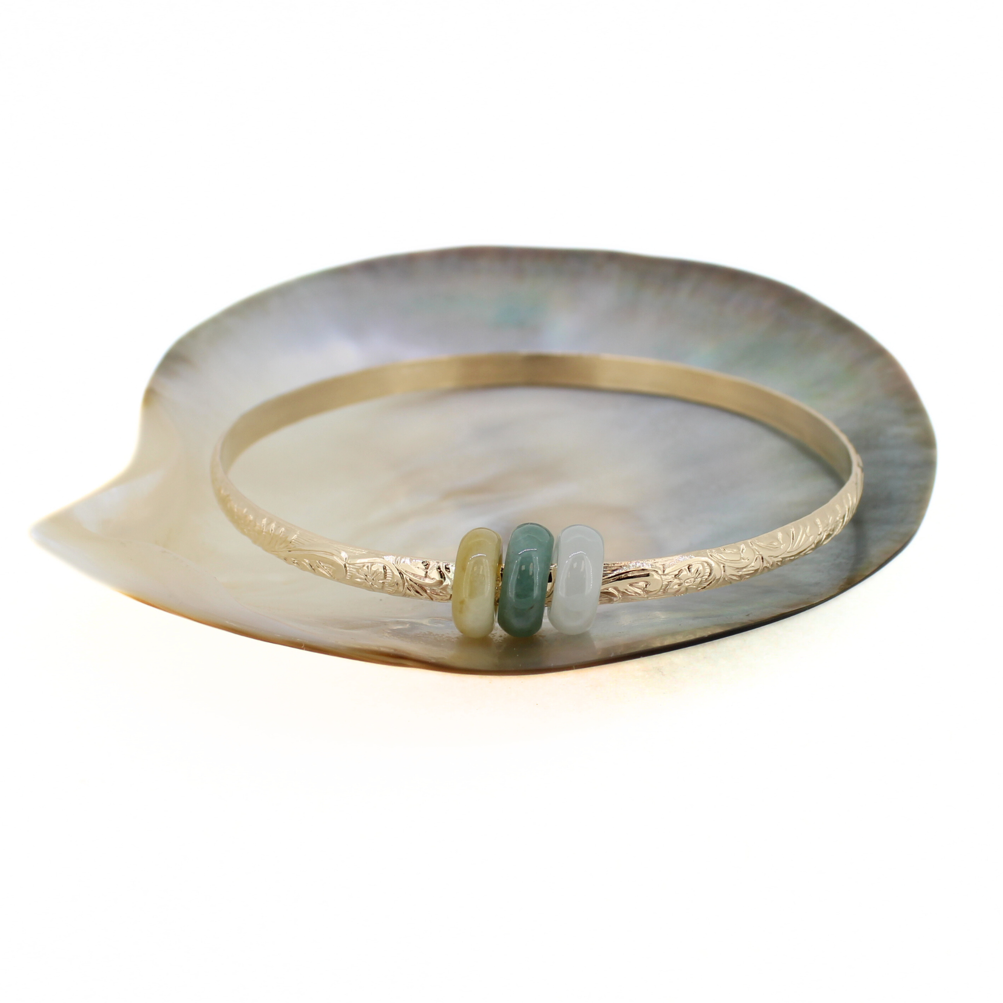 Brianne & Co. 14k gold fill Hawaiian heirloom angle with three colorful jade donut shaped beads