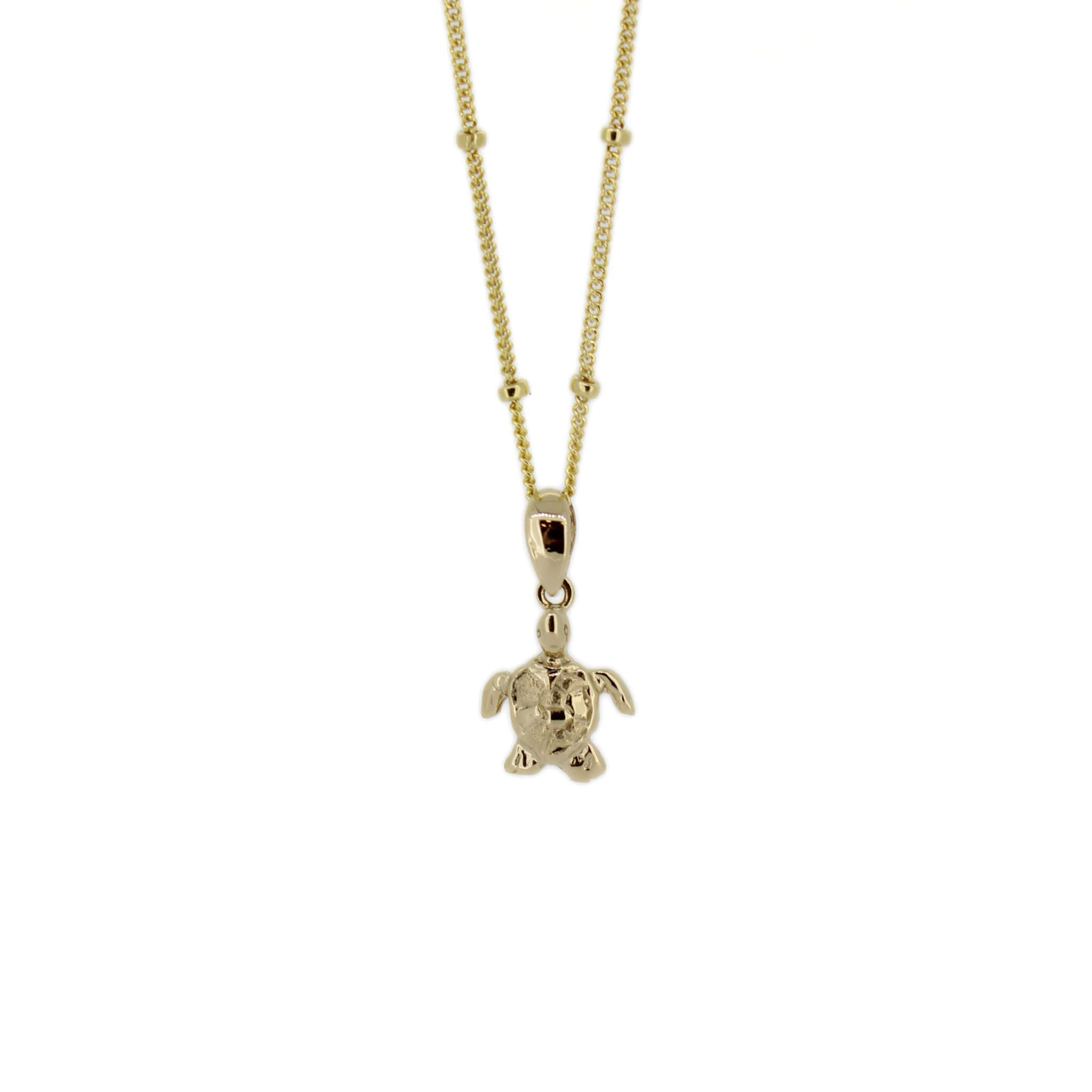 Gold mini honu turtle pendant necklace with small satellite chain