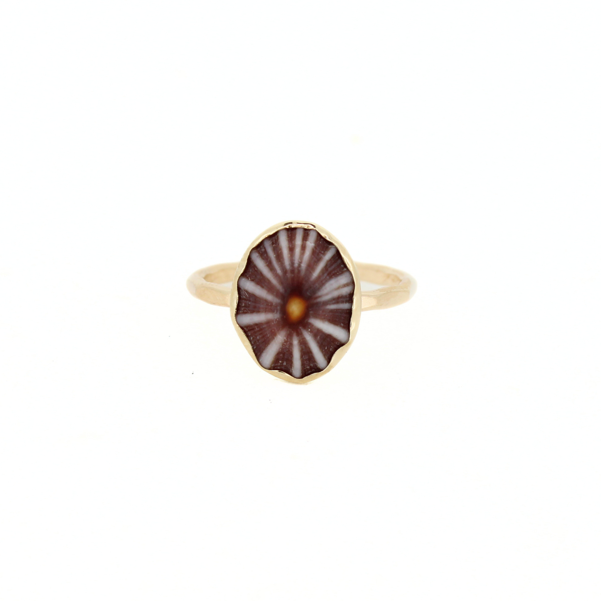 Gold-tone ring with maroon radial shell centerpiece in a hex bezel, slim band