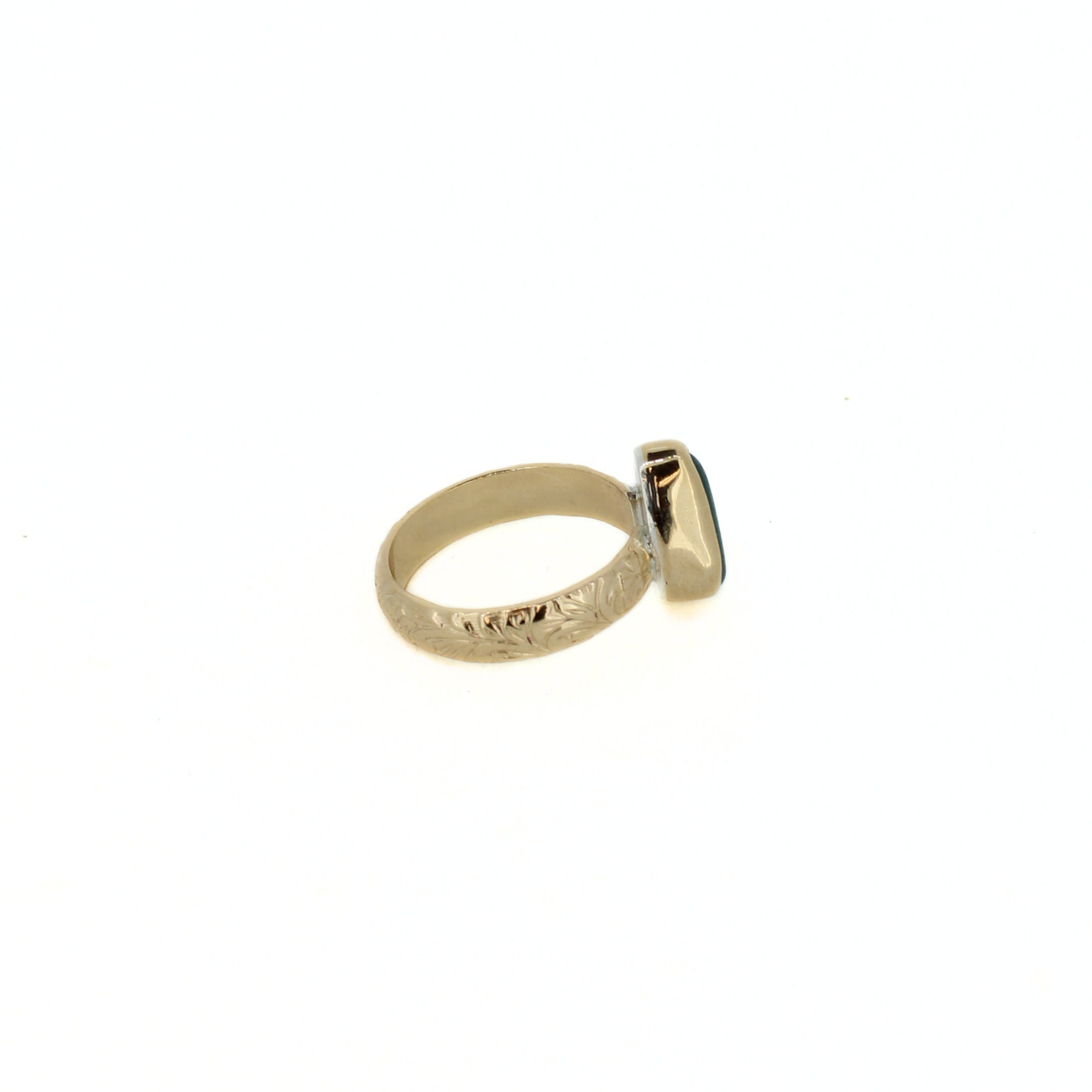 Gold-tone ring with teal sea-glass teardrop bezel and thick open shank.