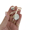 Brianne & Co. gold sunrise shell and sea glass bypass style cuff back side