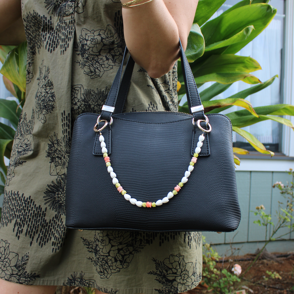 Brianne & Co. short purse lei featuring resin pikake, pakalana and crown flowers handmade in Kauai
