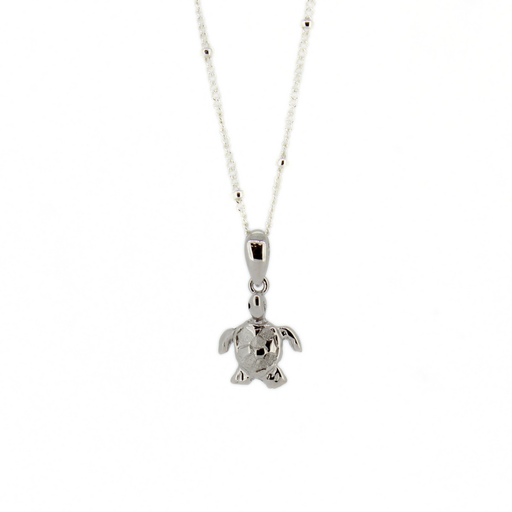 Brianne & Co. tiny silver honu turtle pendant on a satellite chain