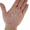 Brianne & Co. sterling silver 15mm hoop earrings with light pink Edison keshi pearls on hand for size reference