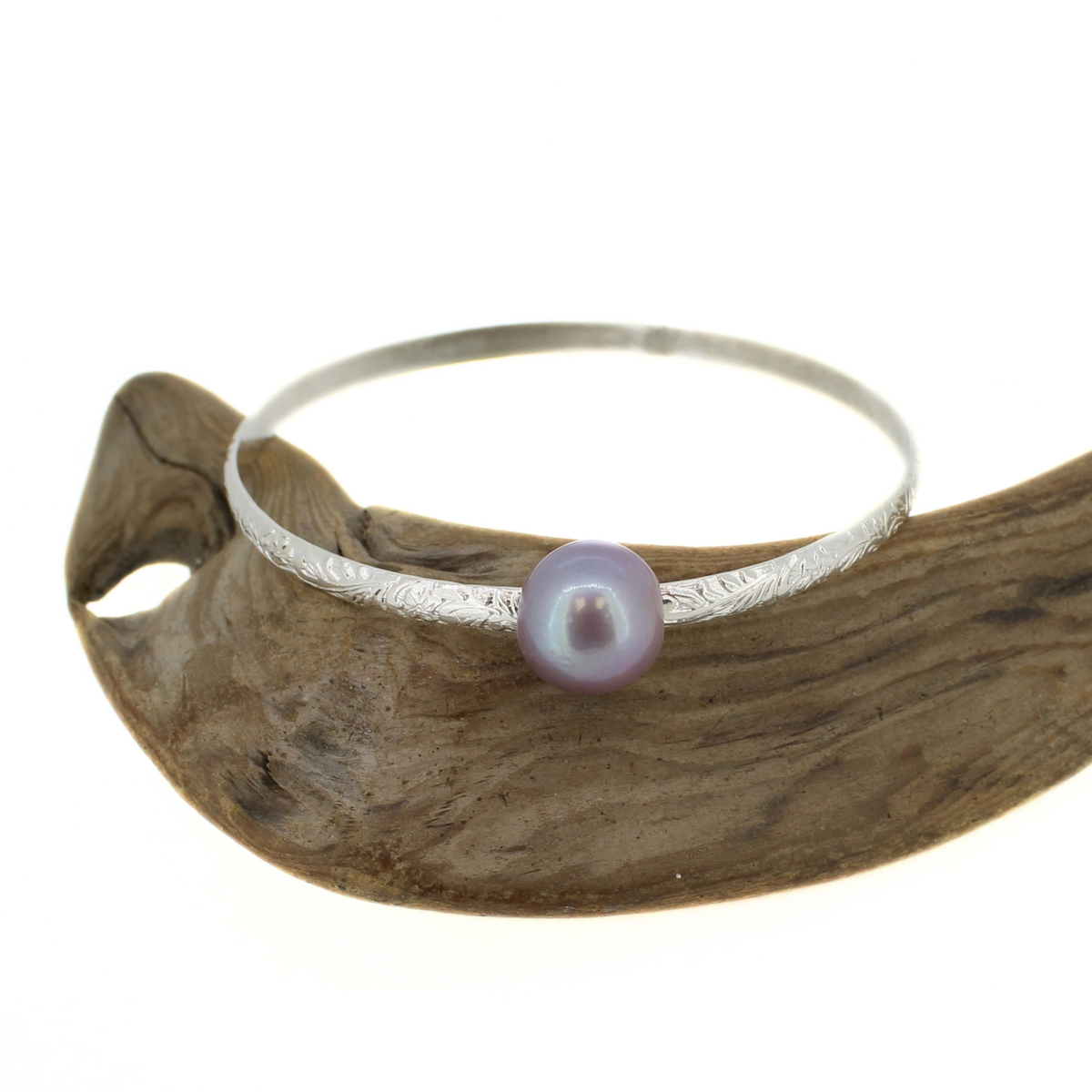 Sterling silver bangle bracelet with a floral printed design and a large purple fresh water Edison pearl