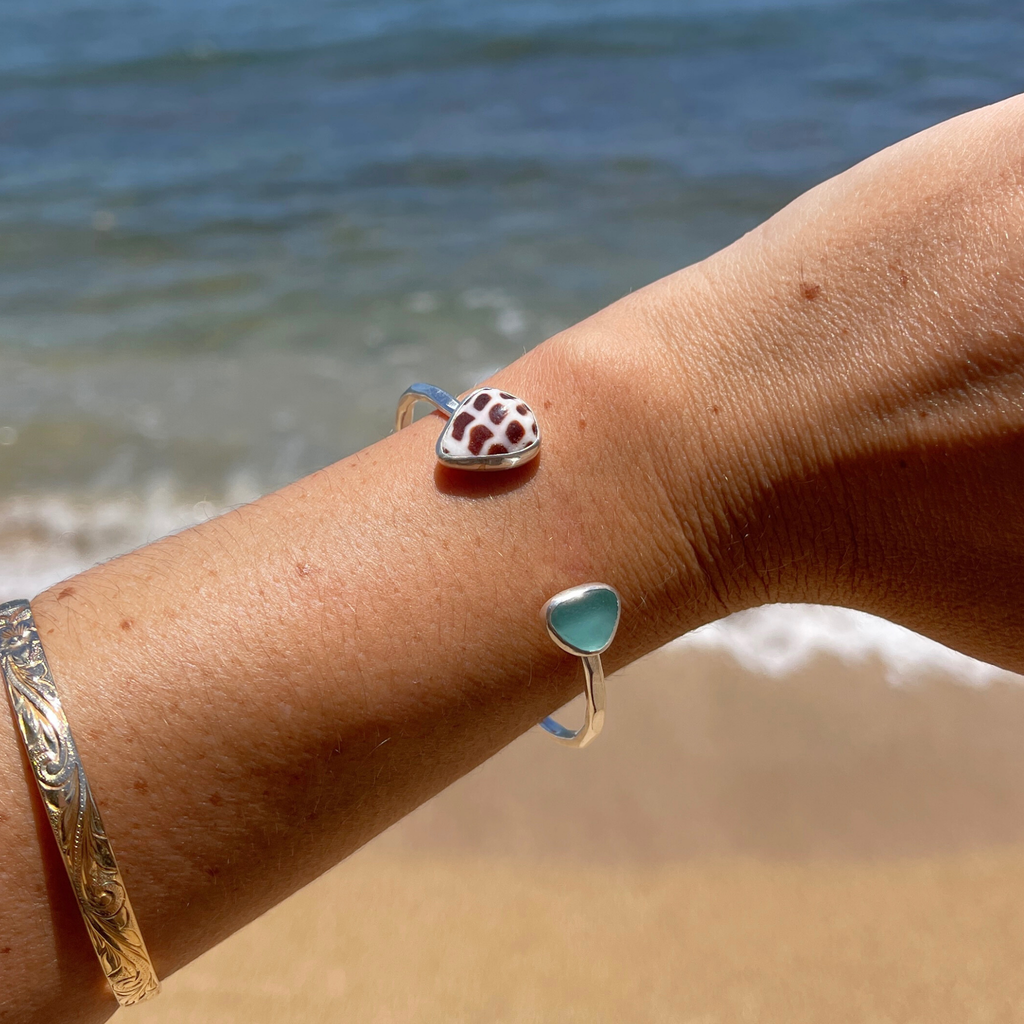 Sterling silver Hebrew cone shell and blue sea glass cuff bracelet handmade on Kauai by Brianne & Co.