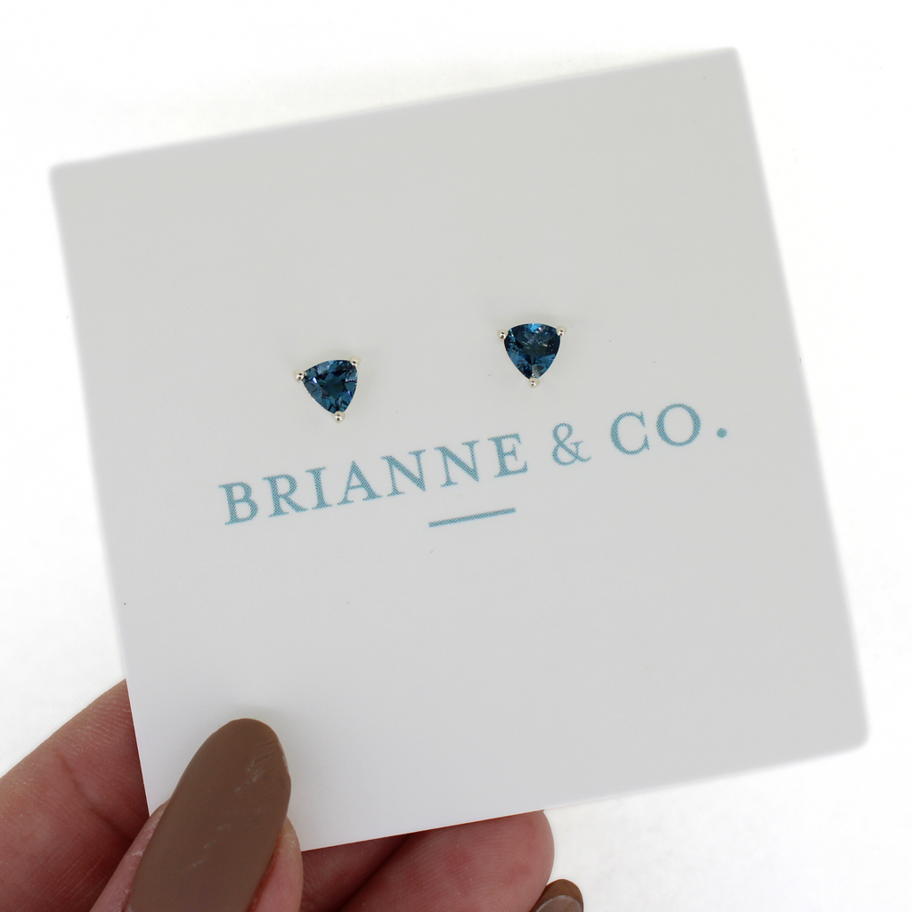 Brianne & Co. dark blue London blue topaz stud earrings in sterling silver front view