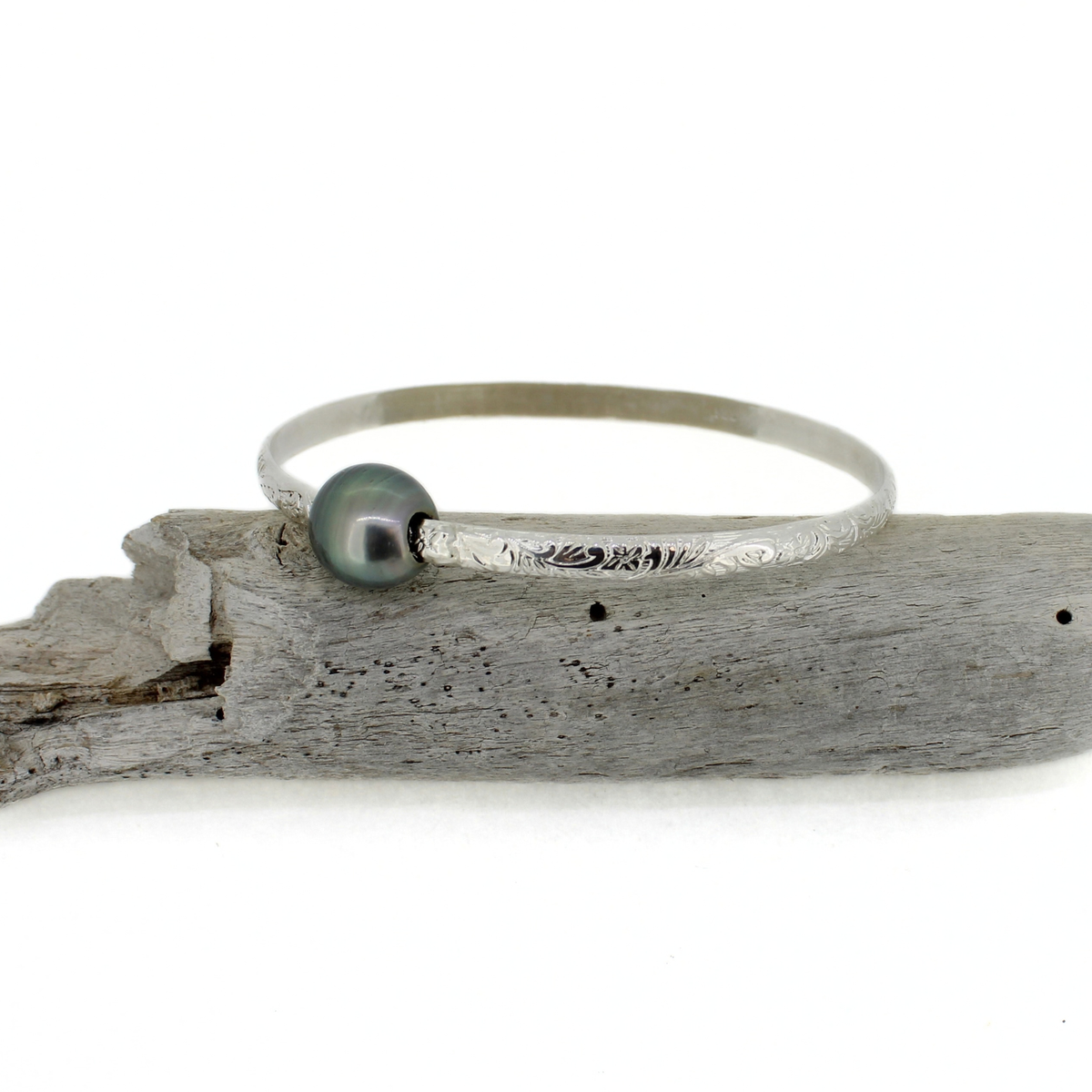 Silver Tahitian pearl bangle with a floral printed design