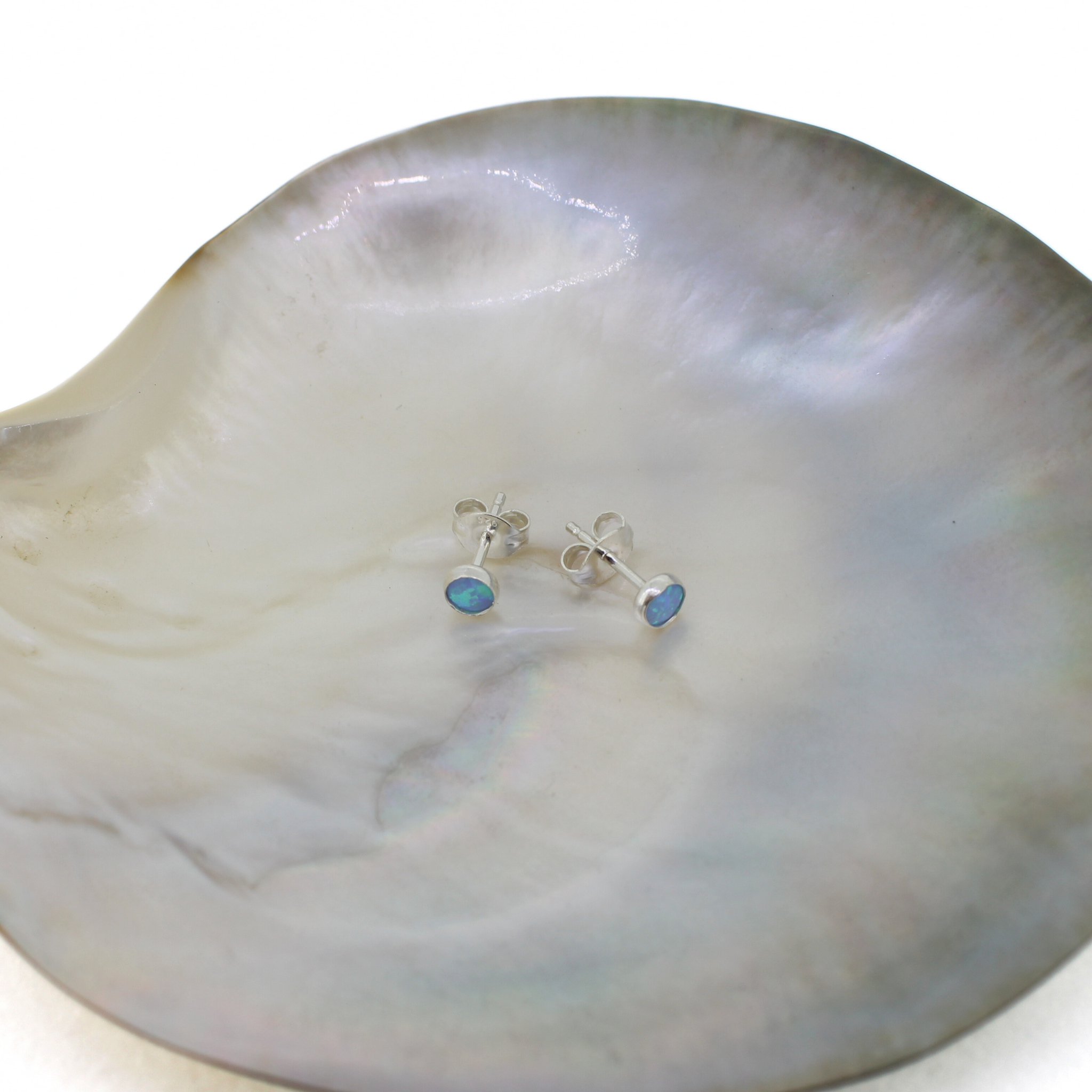 Brianne & Co. sterling silver light blue mini simulated opal stud earrings with butterfly earring backs included