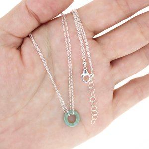 Brianne and Company silver necklace with jade donut pendant