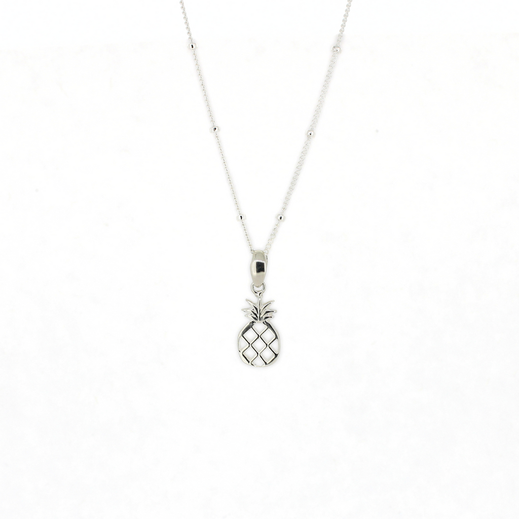 Brianne & Co. Silver pineapple pendant necklace on a white background
