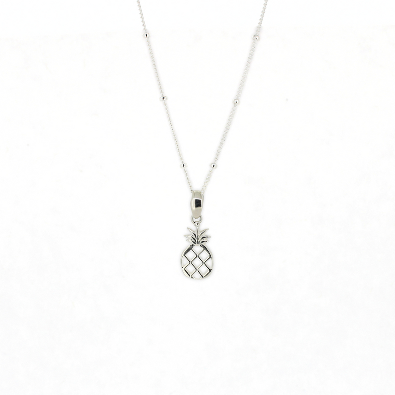 Brianne & Co. Silver pineapple pendant necklace on a white background