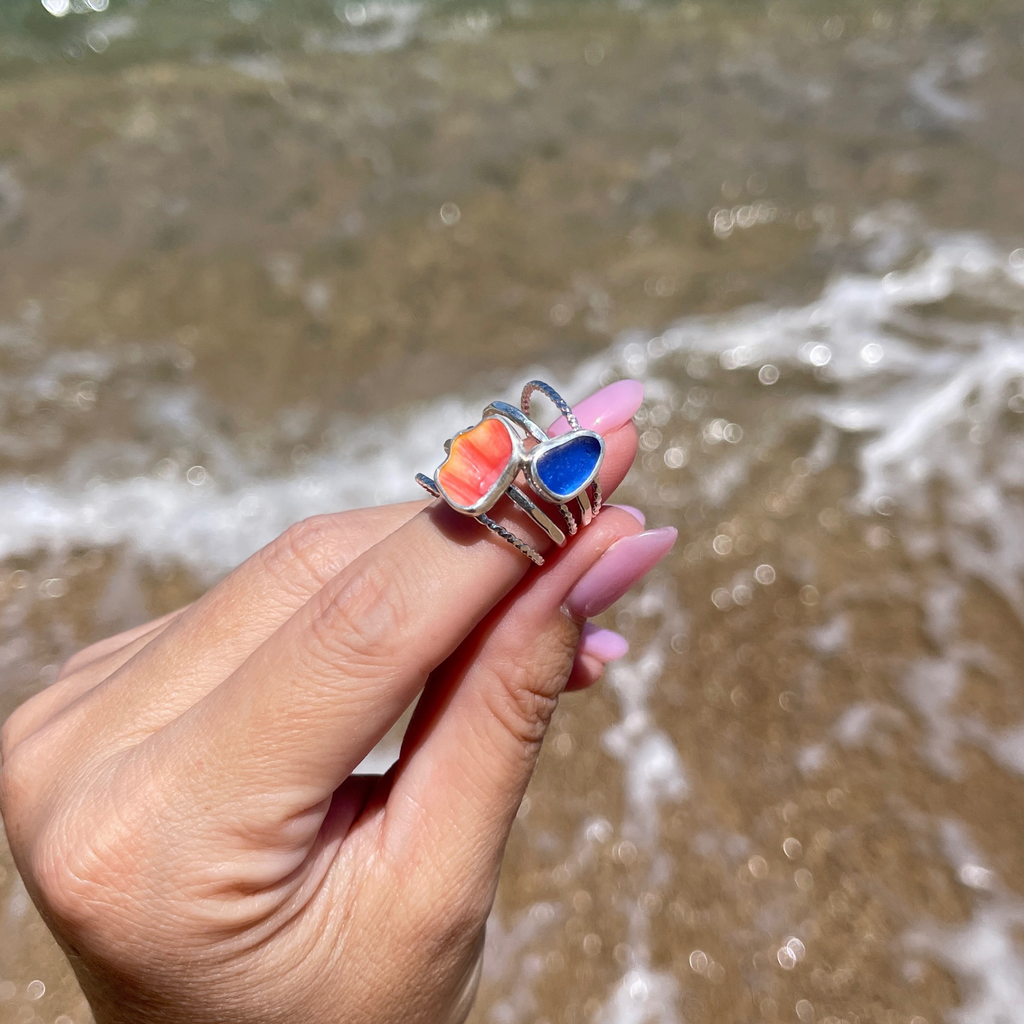 Sterling silver sunrise shell chip and cobalt blue sea glass bezel set stackable ring set handmade on Kauai by Brianne & Co.
