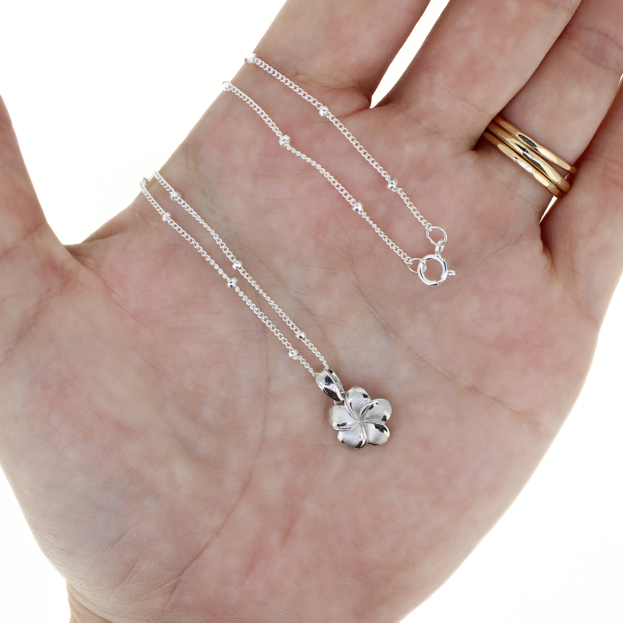 Brianne & Co. small sterling silver plumeria pendant with an 18" satellite chain included