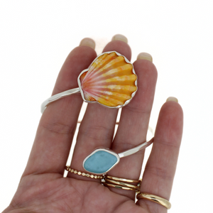 Brianne & Co. sterling silver sea glass and sunrise shell cuff bracelet on hand for size reference