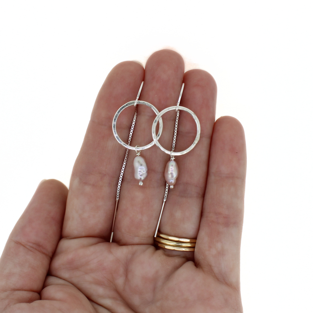 Brianne & Co. sterling silver threader hoop earrings with pink Edison keshi pearls on hand