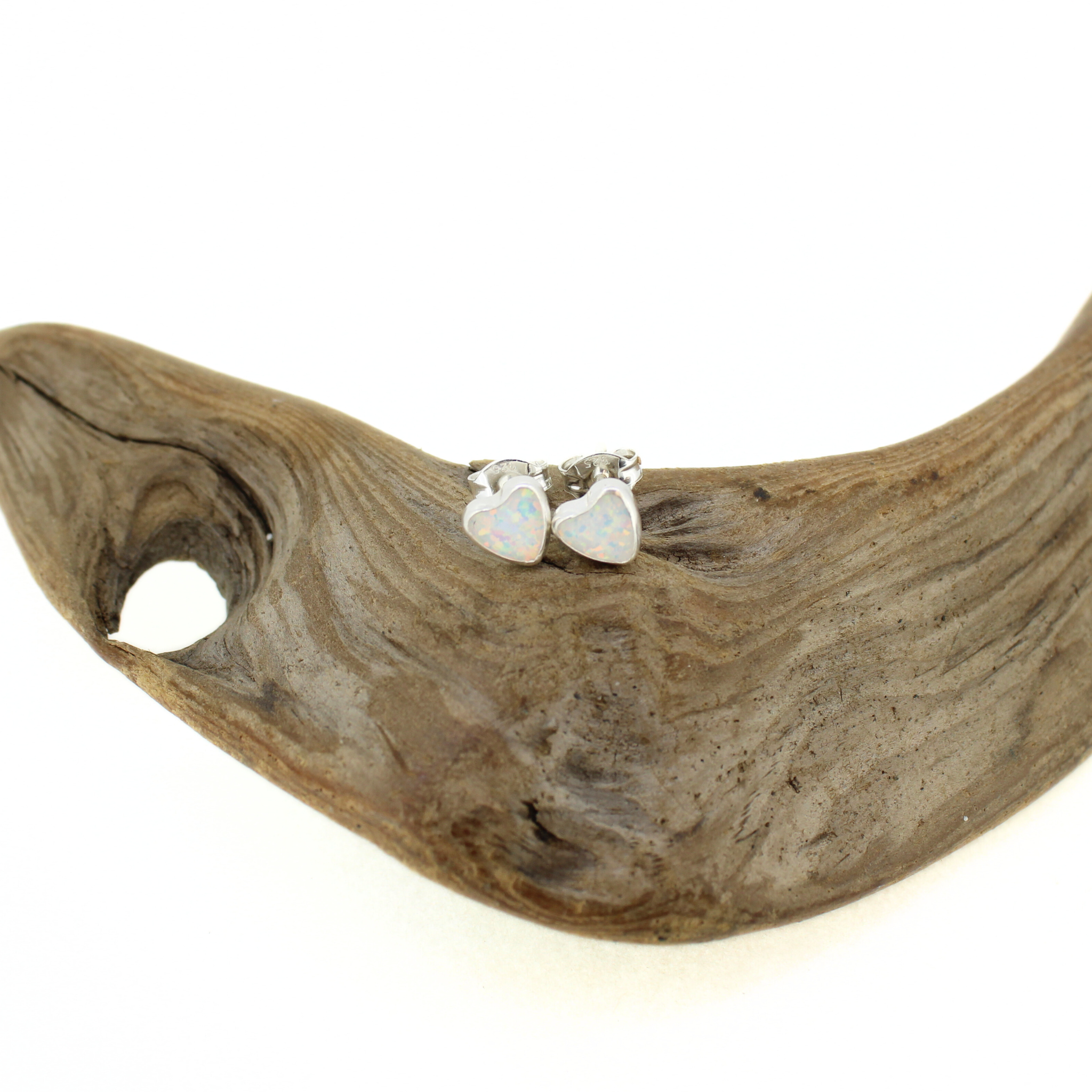 Brianne & Co. sterling silver heart shaped simulated opal stud earrings measuring just over 6mm tall