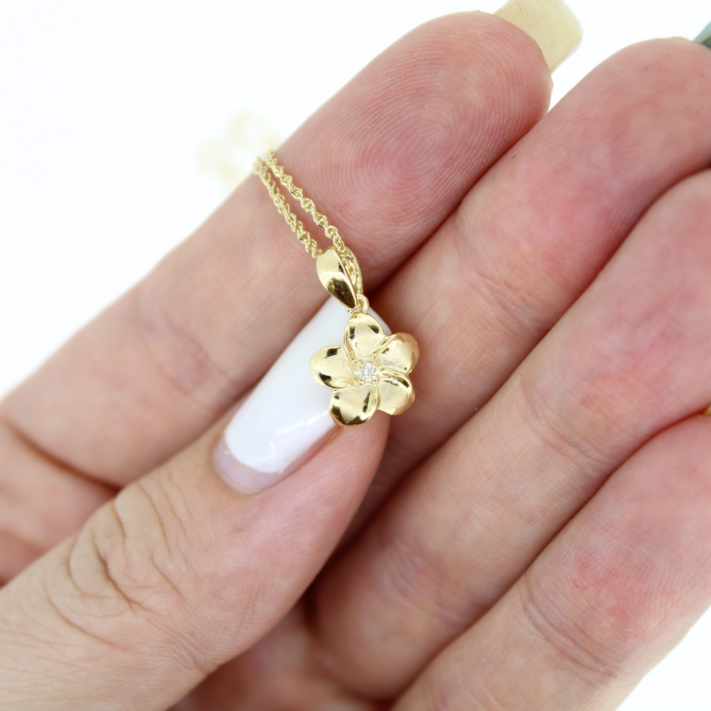Brianne & Company 14k gold necklace with plumeria pendant and diamond