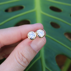 14k gold moissanite earrings close up from Brianne & Co