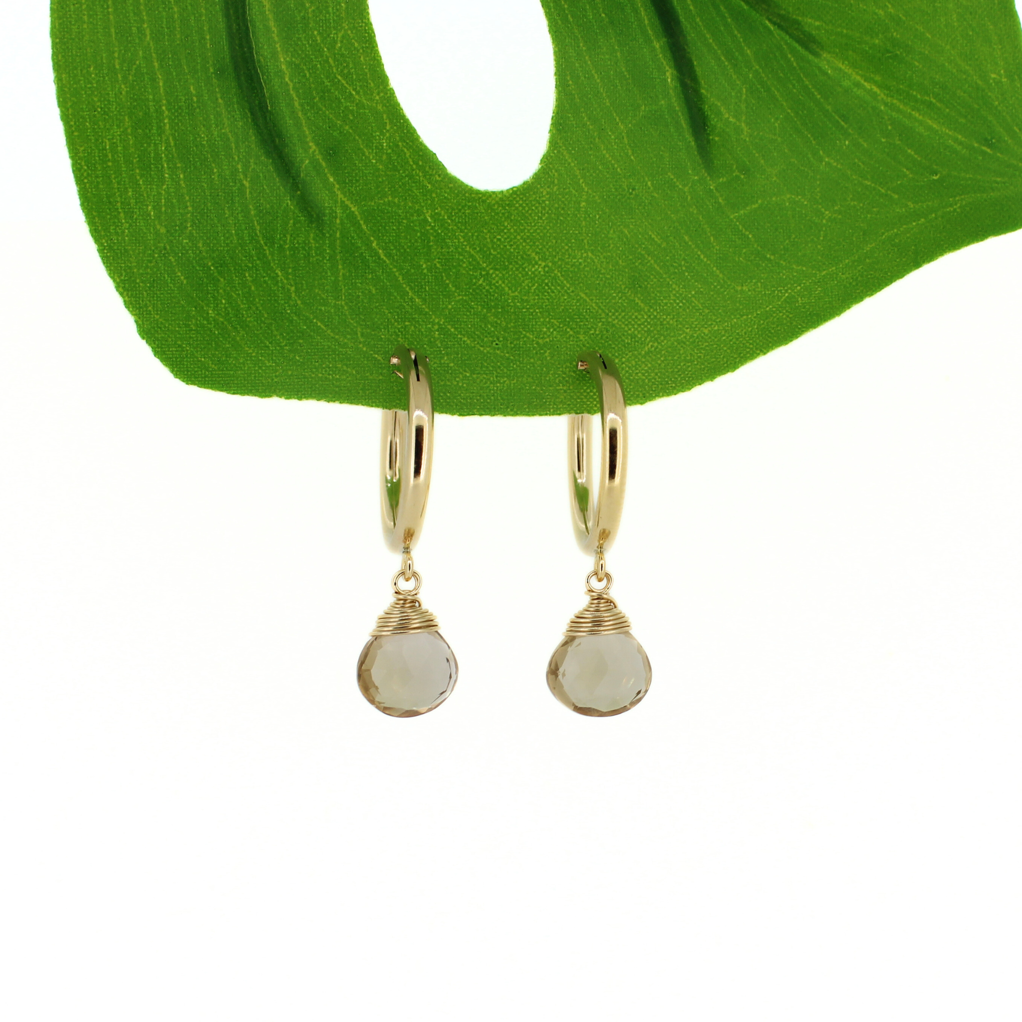 Gold hoop earrings with round faceted champagne topaz dangle charms