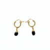 Brianne and Co flat lay of gold fill huggie hoop black spinel gemstone earrings