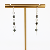 Brianne & Co handcrafted sterling silver tahitian keshi pearl earrings shown on earring stand