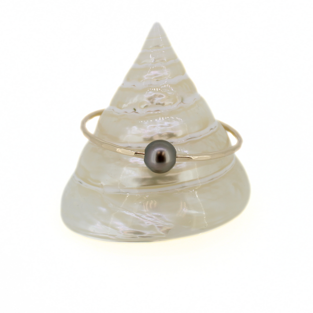 Brianne and Company Tahitian Pearl Keiki bangle on a cone shell