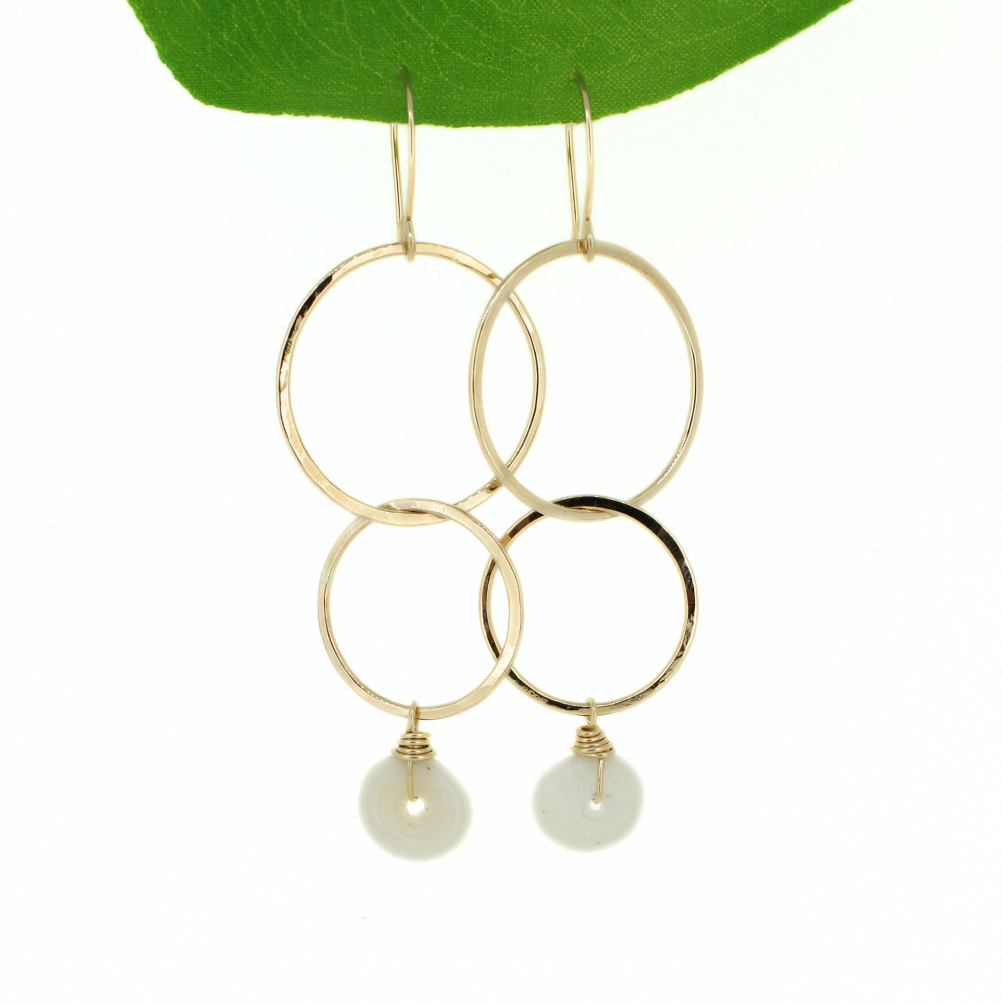 Brianne & Co. 14k gold fill double hoop earrings featuring Kauai puka shells