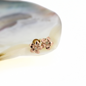 Brianne and Company hand crafted 14k rose gold stud earrings with plumeria and diamond at center