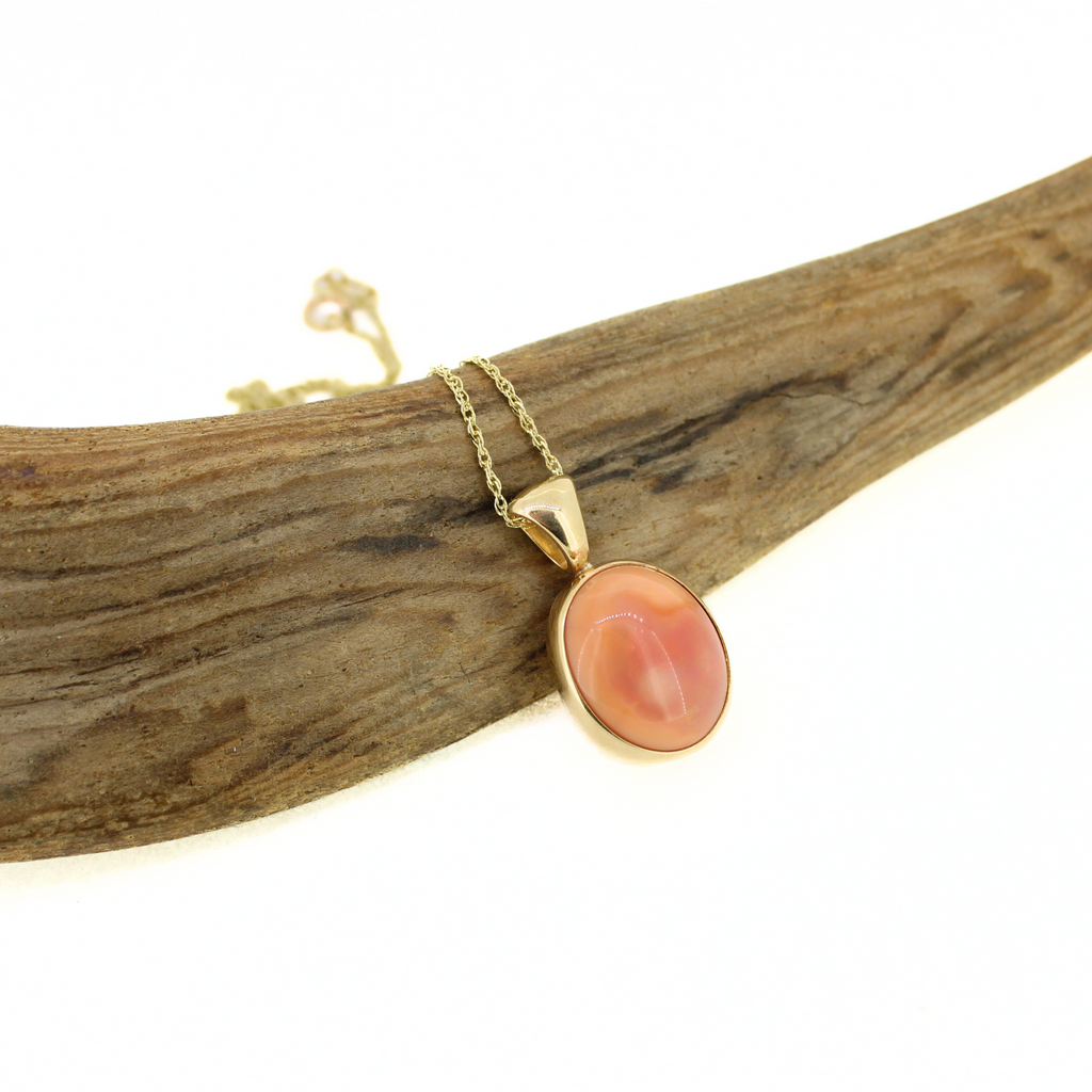 Brianne & Co. pink Mexican fire opal bezel set into a 14k gold necklace